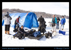 Divers preparing for ice diving in MN. The ice was 2 feet... by Margo Cavis 